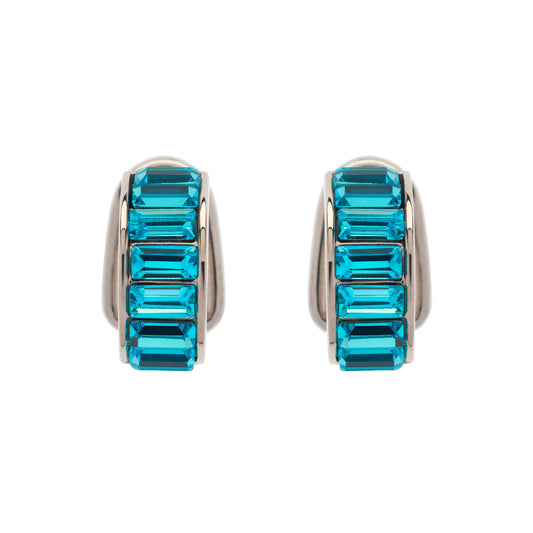 Pair of earrings with blue gemstones on a white background