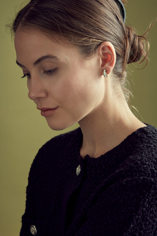 Model with crystal baguette ear cuff