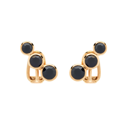 Gold earrings with black stones on a white background