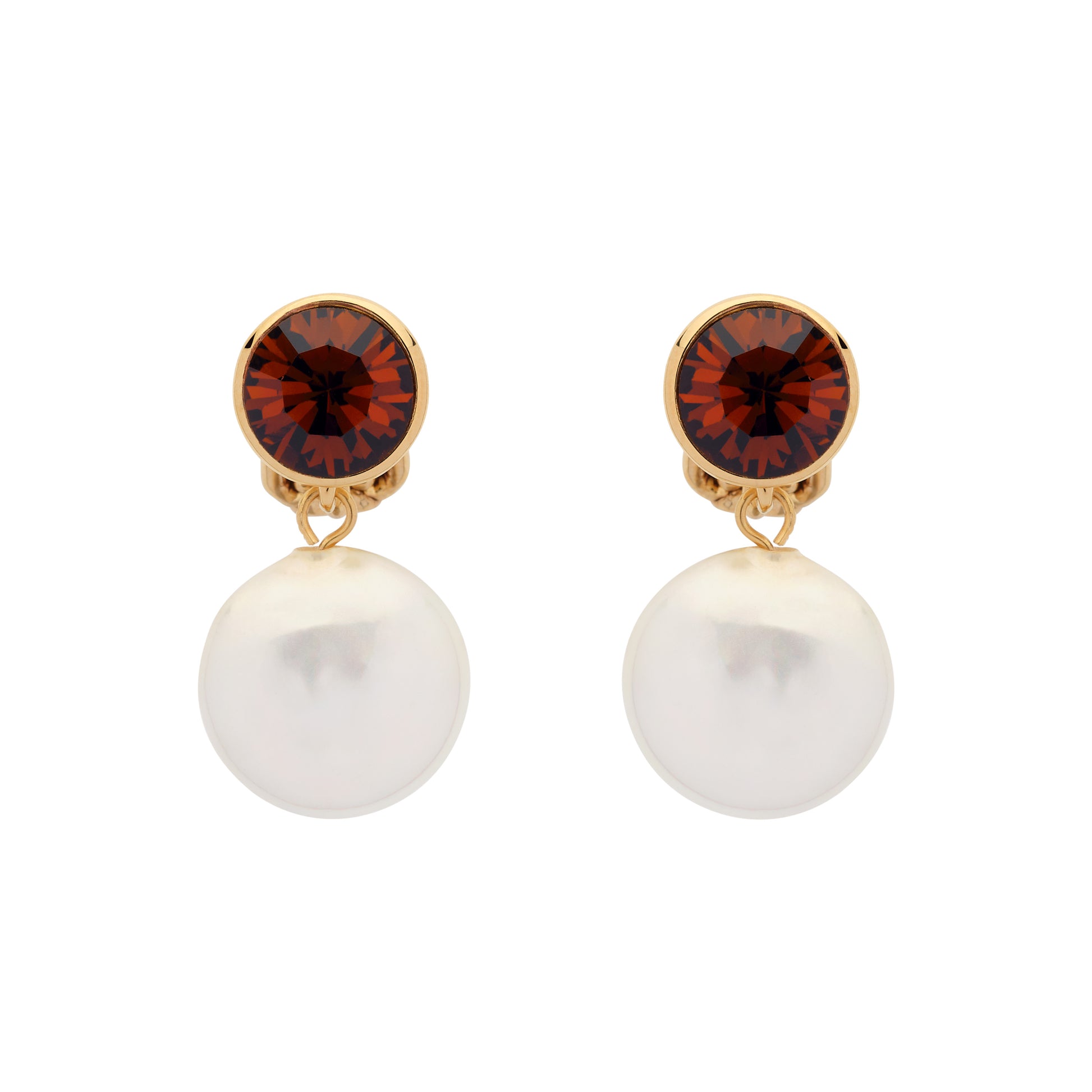 Pair of earrings with red gemstones and pearl-like bottoms on a white background
