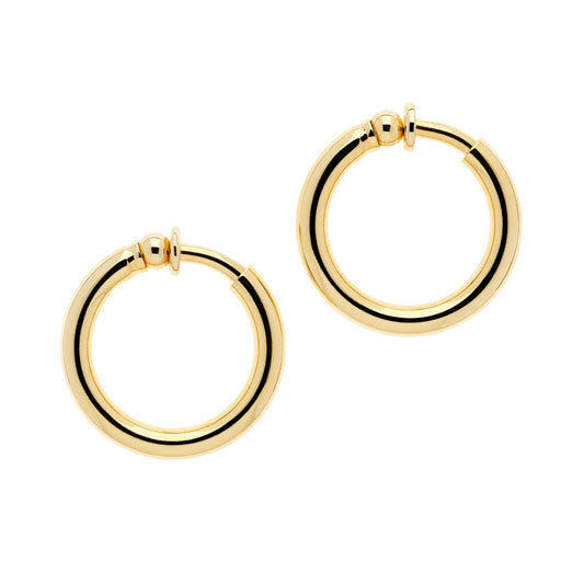 A pair of gold hoop clip earrings with a polished finish on a white background.