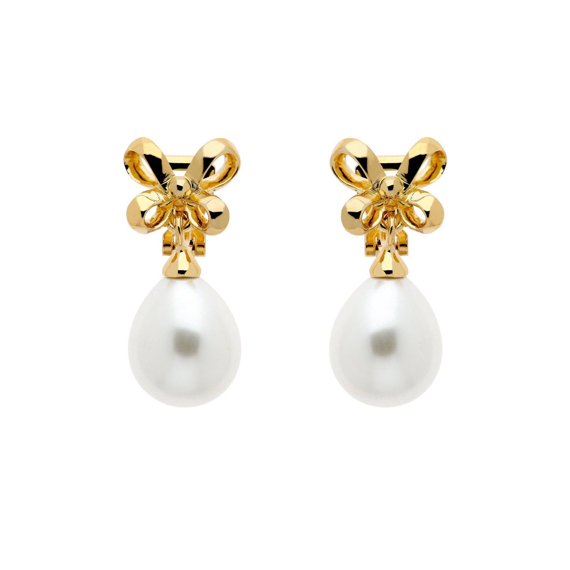 A pair of gold clip earrings featuring a bow design atop a faux pearl drop.