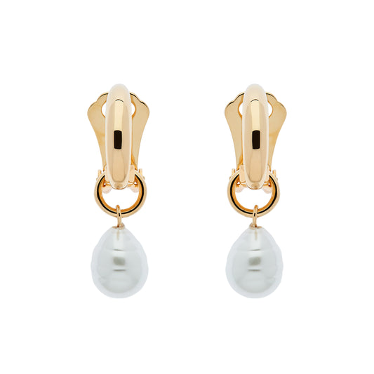 A pair of gold clip-on hoop earrings with baroque pearl charms dangling from them.