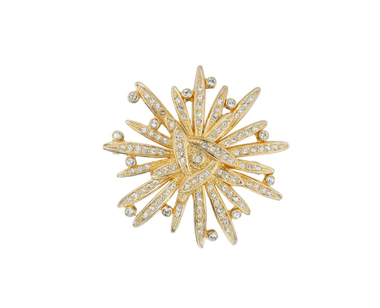 A gold plated crystal encrusted brooch