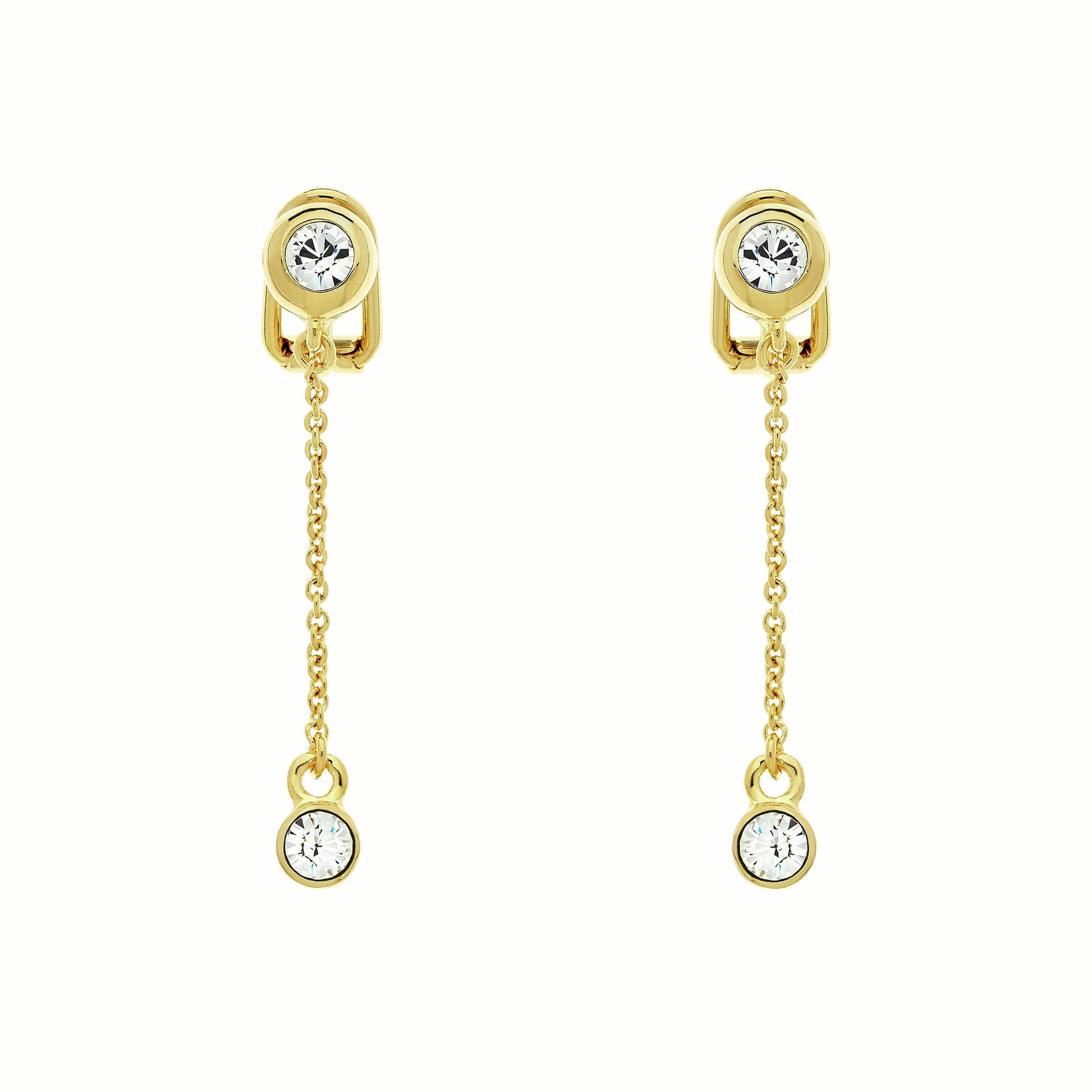 A pair of gold clip-on earrings featuring a crystal charm on a chain.