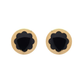 Pair of gold earrings with black center on a white background