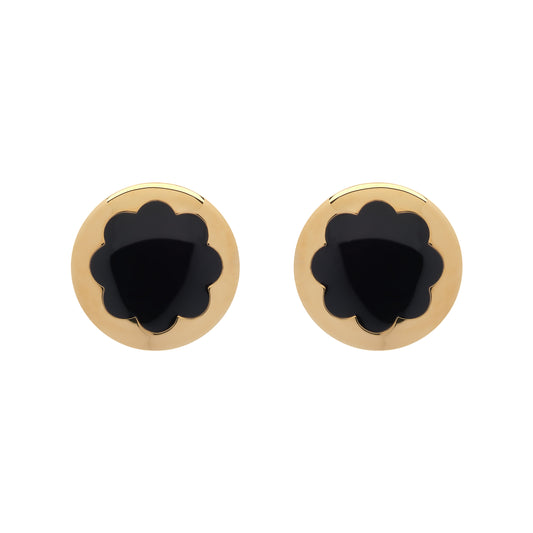 Pair of gold earrings with black center on a white background