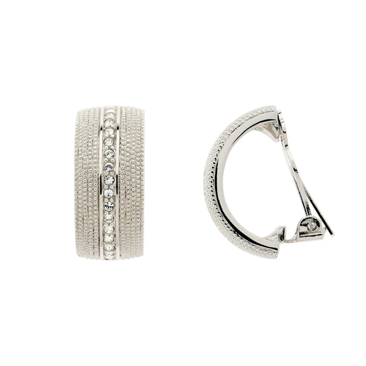 A pair of platinum clip earrings with a curved design and adorned with clear crystals.