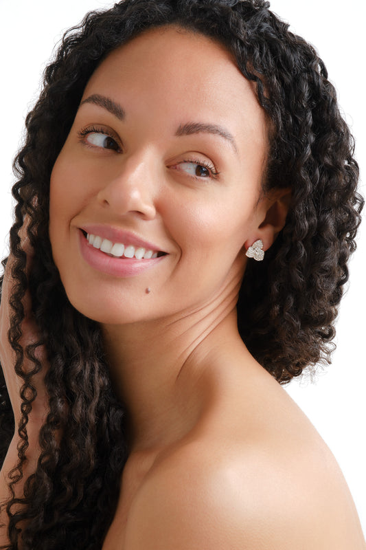 A model wearing platinum crystal flower earrings