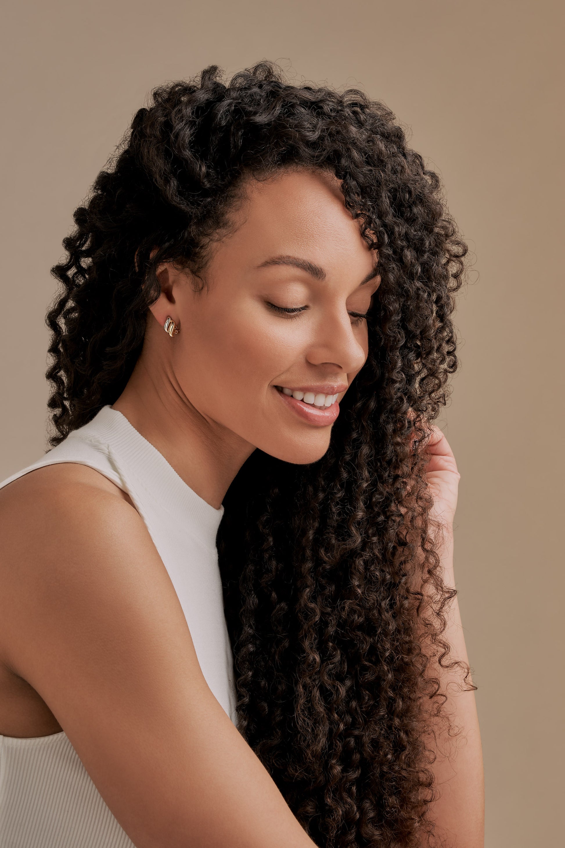 Model with gold and platinum clip on earrings