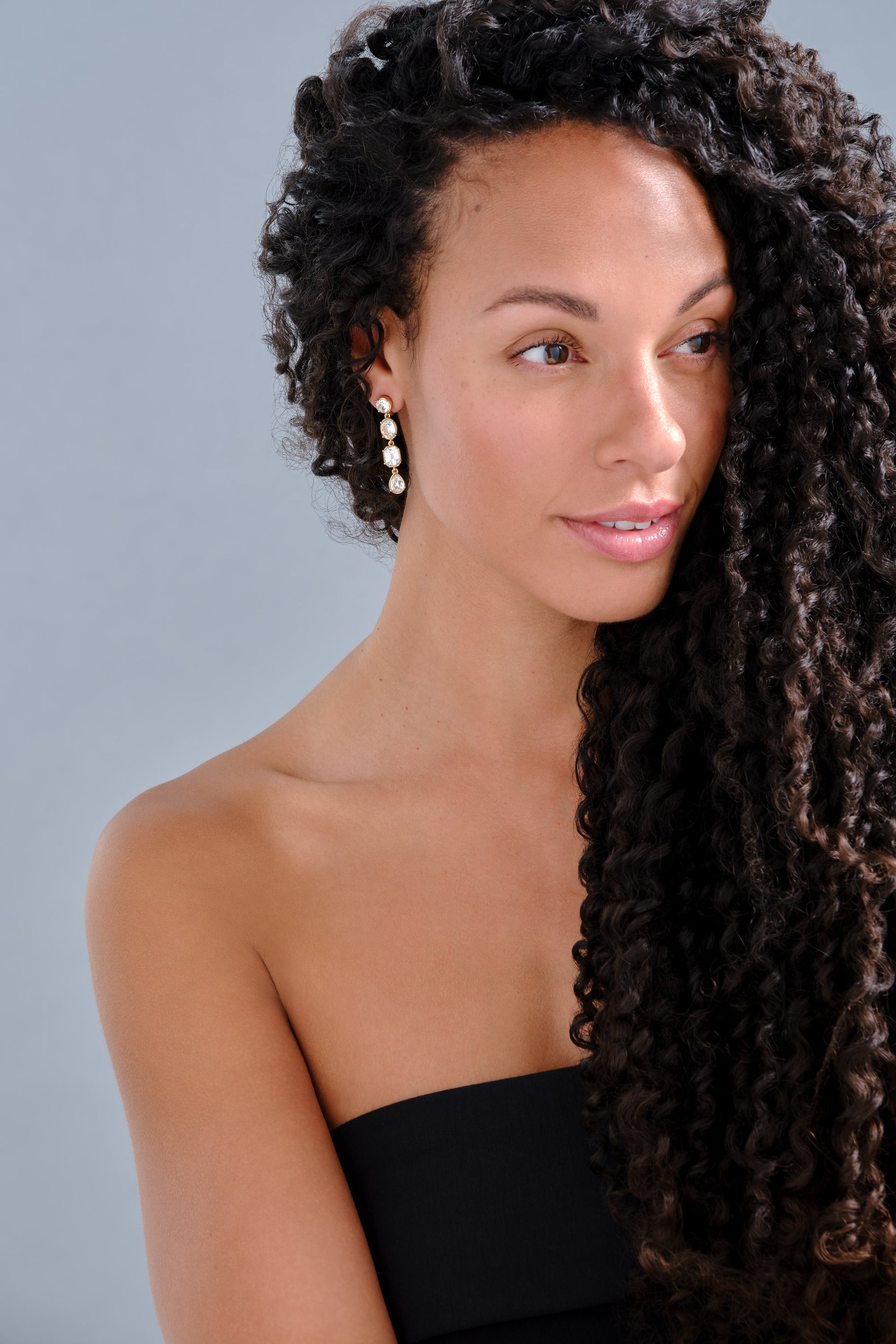 model with Emma Holland crystal clip on statement earrings