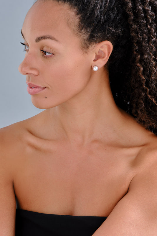 pink pearl earrings on model