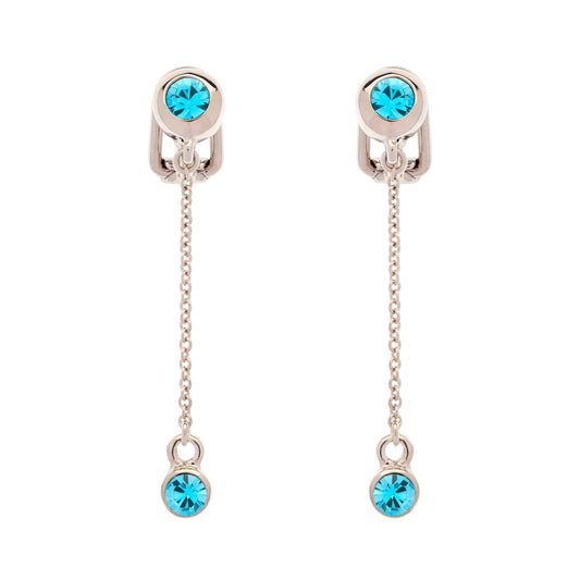 A pair of silver-toned drop earrings, each featuring a round light blue crystal at the top and a smaller matching light blue crystal dangling at the bottom, suspended by delicate chains.