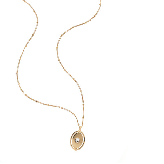 Gold necklace with a pendant on a white background