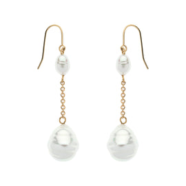 Pair of pearl earrings with gold hooks on a white background