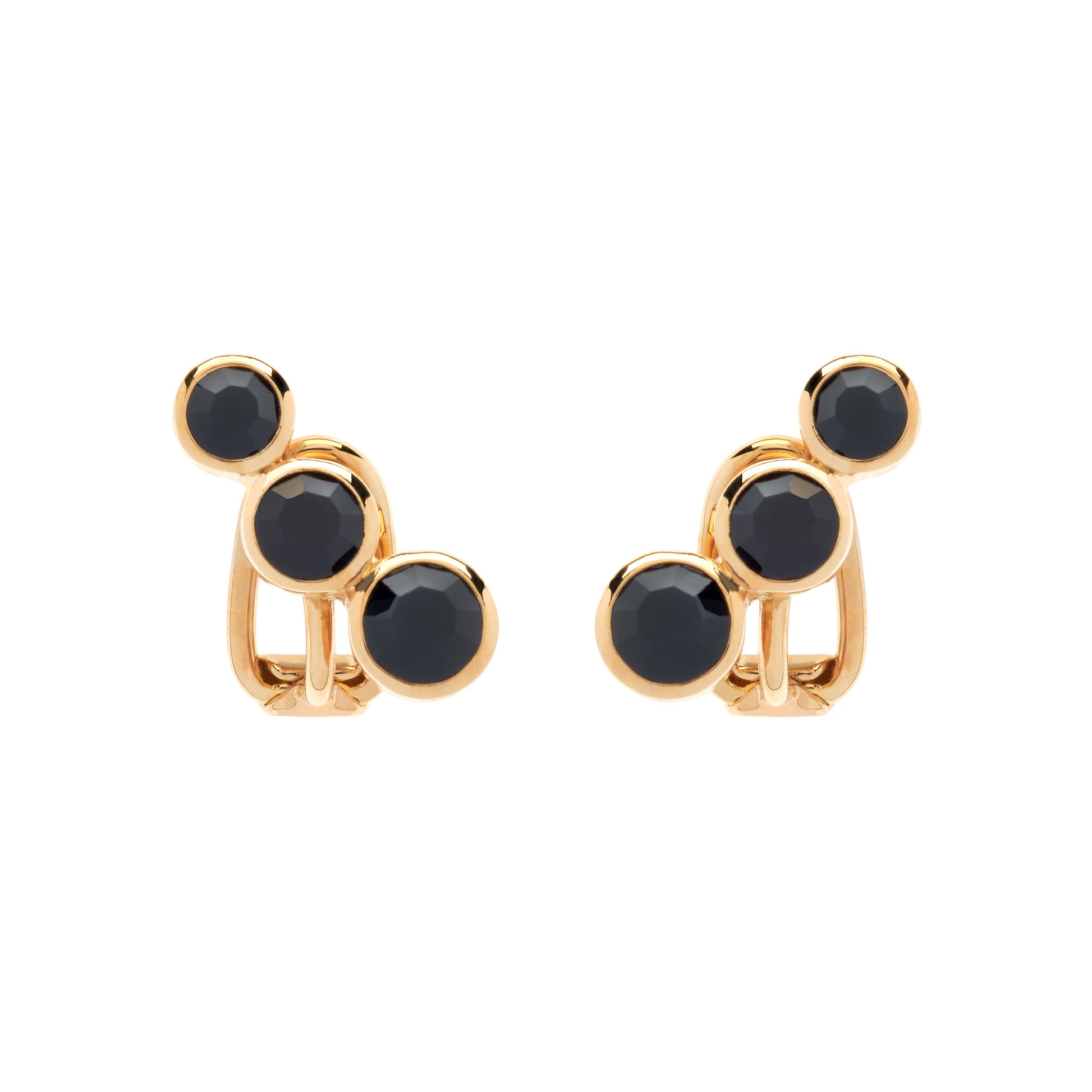 Gold earrings with black stones on a white background