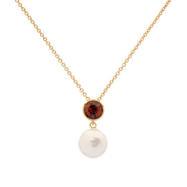 Gold necklace with a brown gemstone and pearl on a white background
