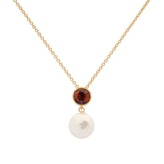 Gold necklace with a brown gemstone and pearl on a white background