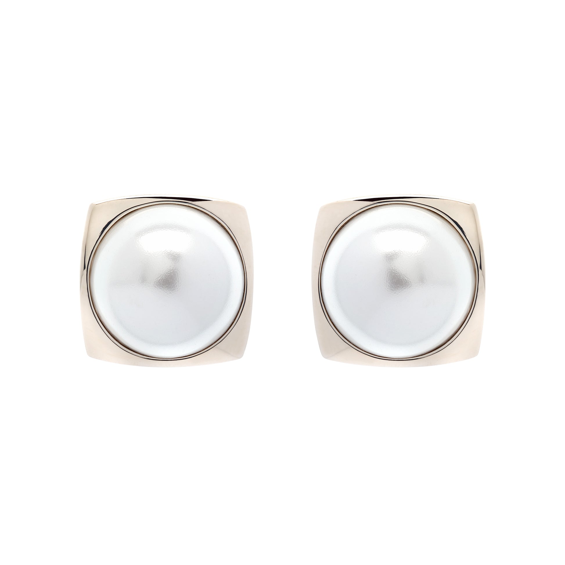 Pair of pearl earrings with gold frames on a white background