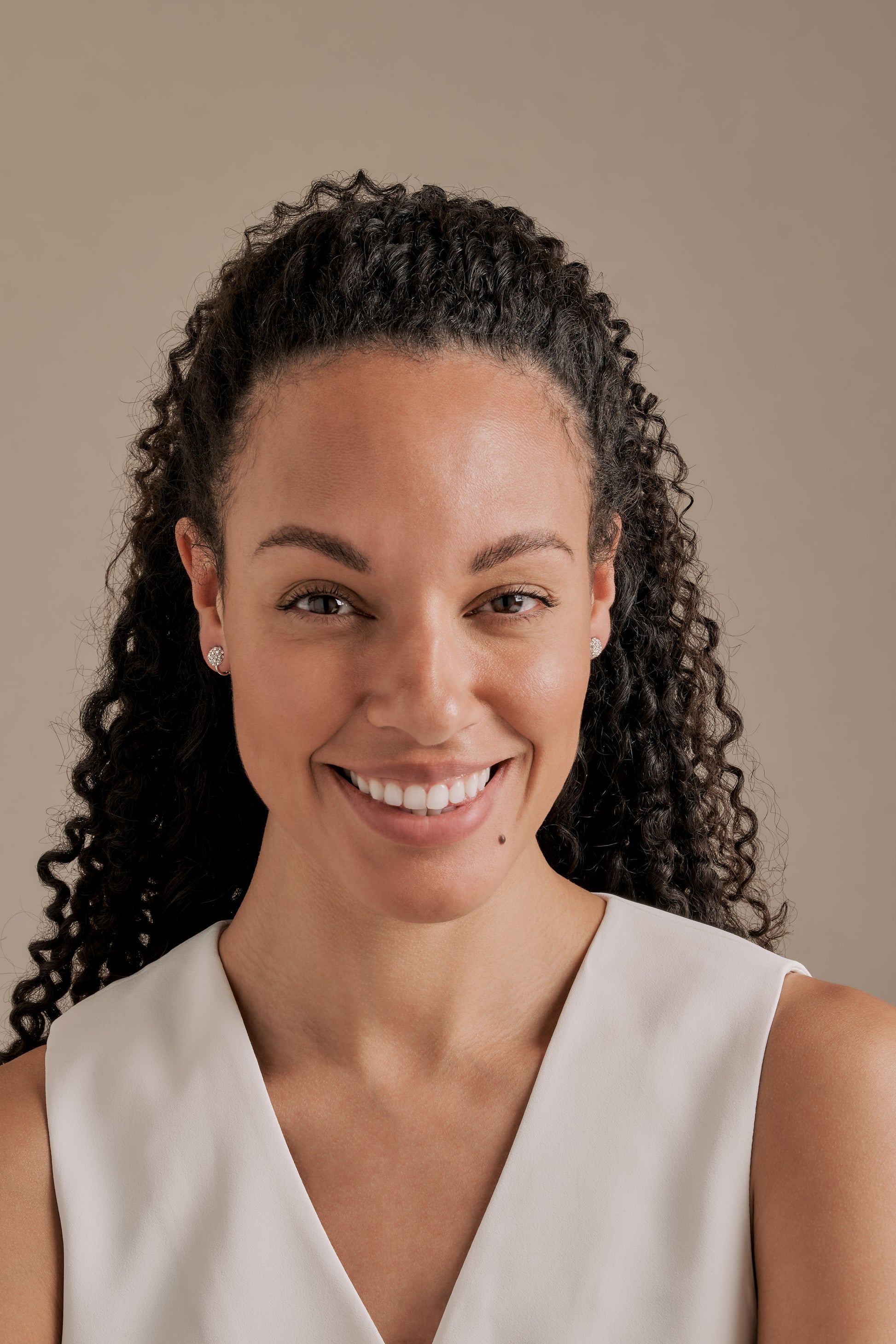 A model with crystal clip on earrings
