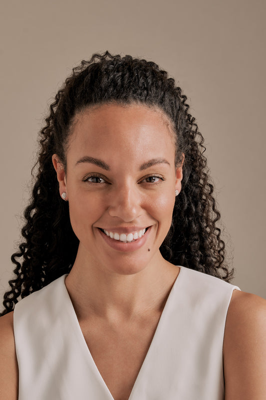 A model with crystal clip on earrings