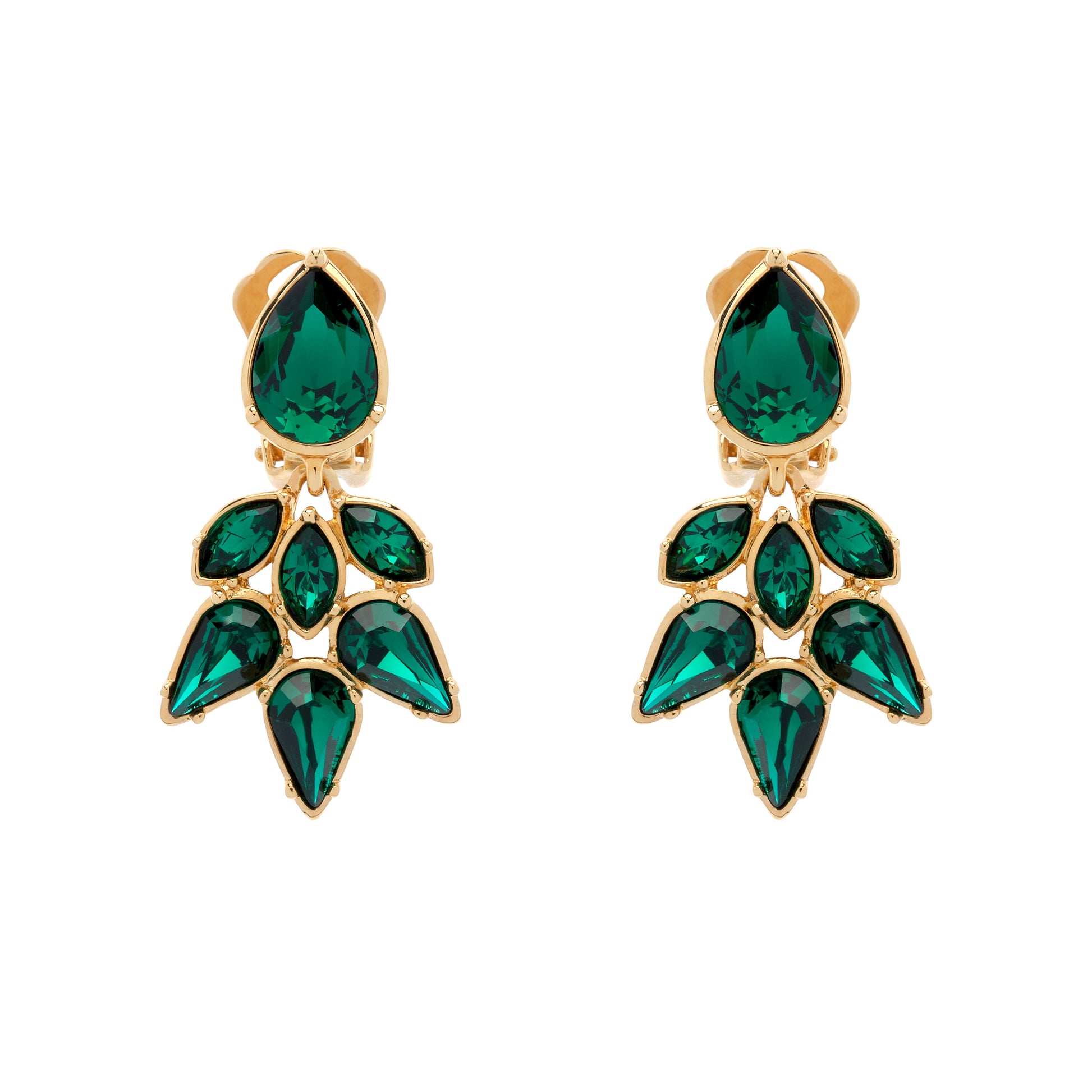 Gold earrings with green gemstones on a white background