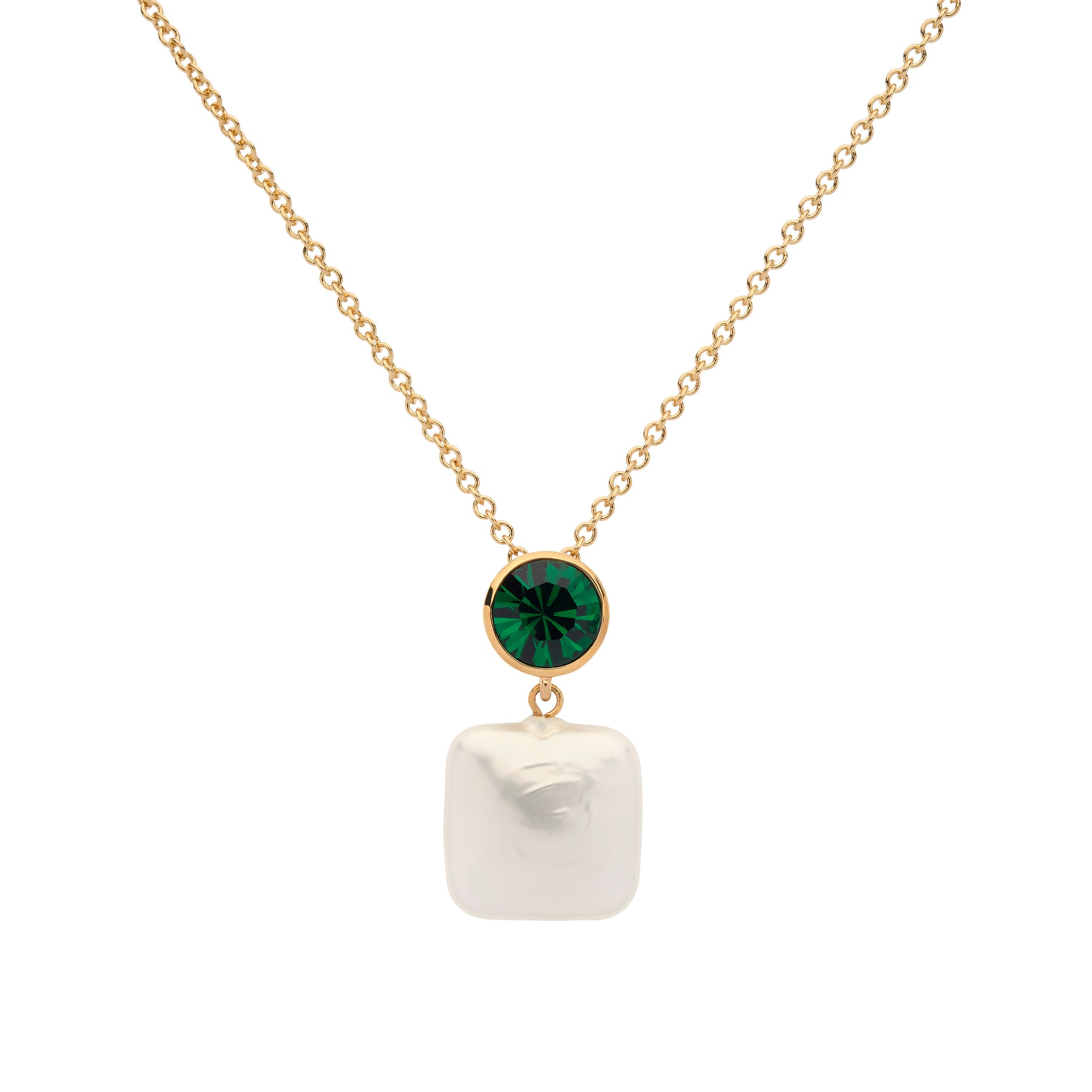 Gold necklace with a green gemstone and white pearl pendant on a white background