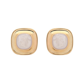 Pair of gold earrings with a central stone on a white background