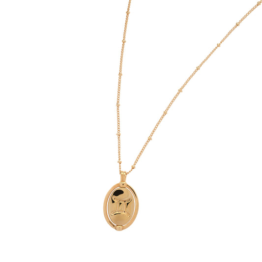 Gold necklace with a pendant on a white background