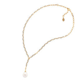 Gold chain necklace with a single pearl on a white background