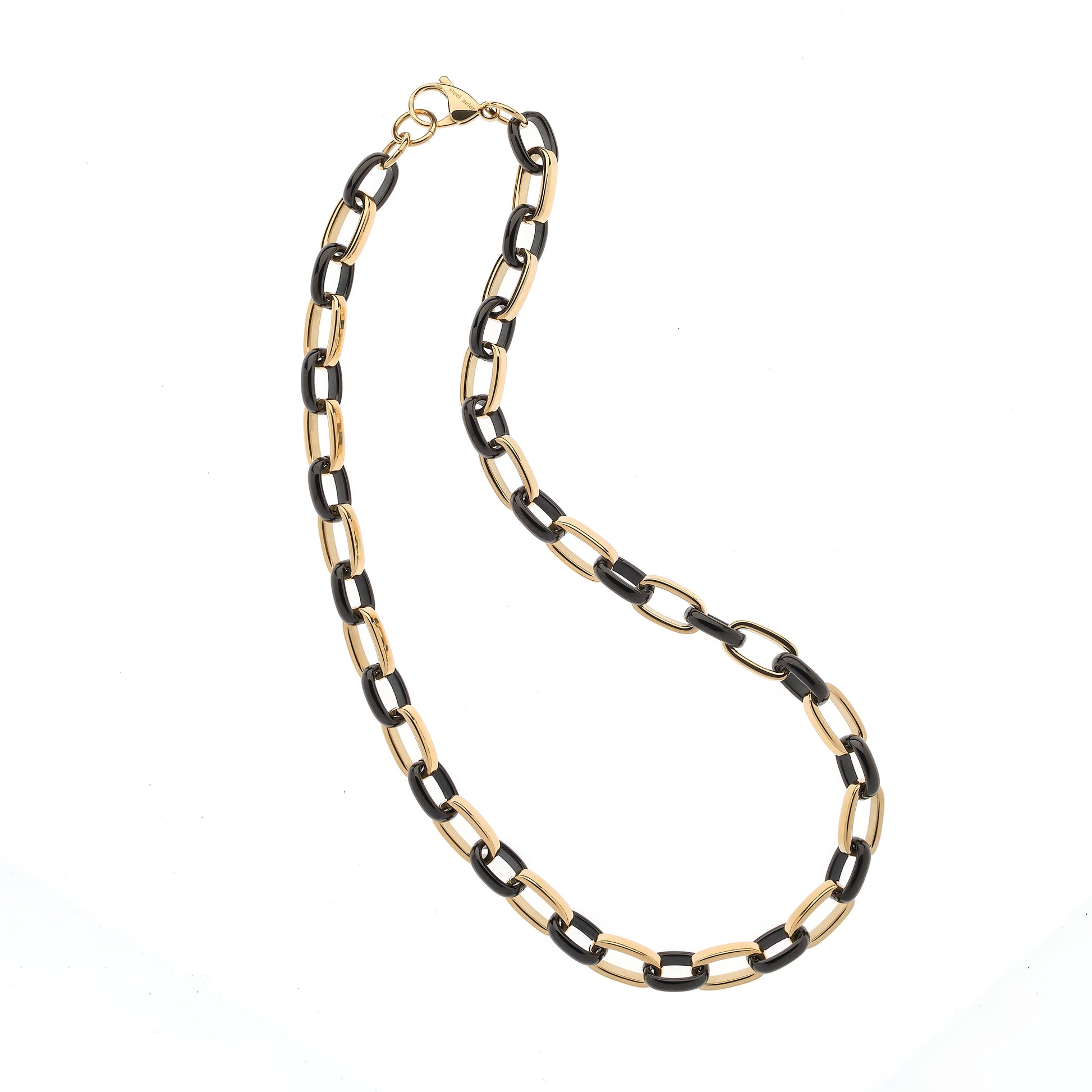 Gold and black chain necklace on a white background