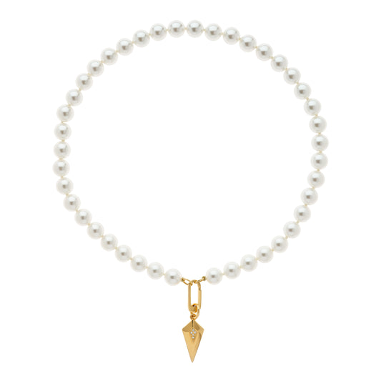 A white faux pearl necklace with a gold Art Deco inspired crystal charm pendant.