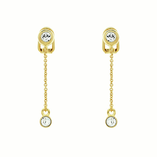 A pair of gold clip-on earrings featuring a crystal charm on a chain.