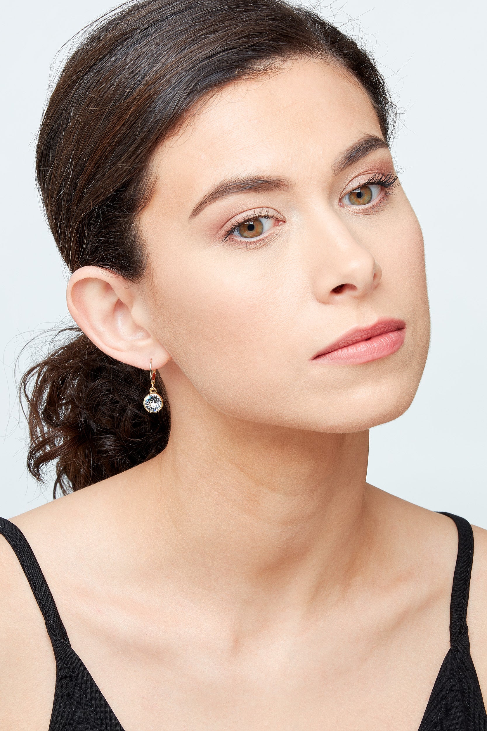 Model with emma holland crystal and gold earrings
