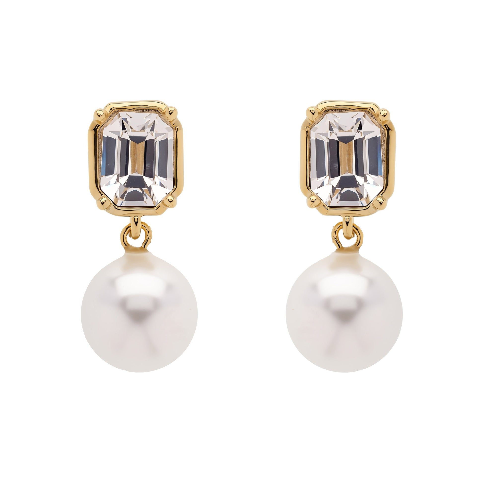 A pair of gold drop earrings featuring an emerald-cut clear crystal and a dangling white pearl, shown against a plain white background.