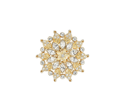 A gold plated crystal studded brooch