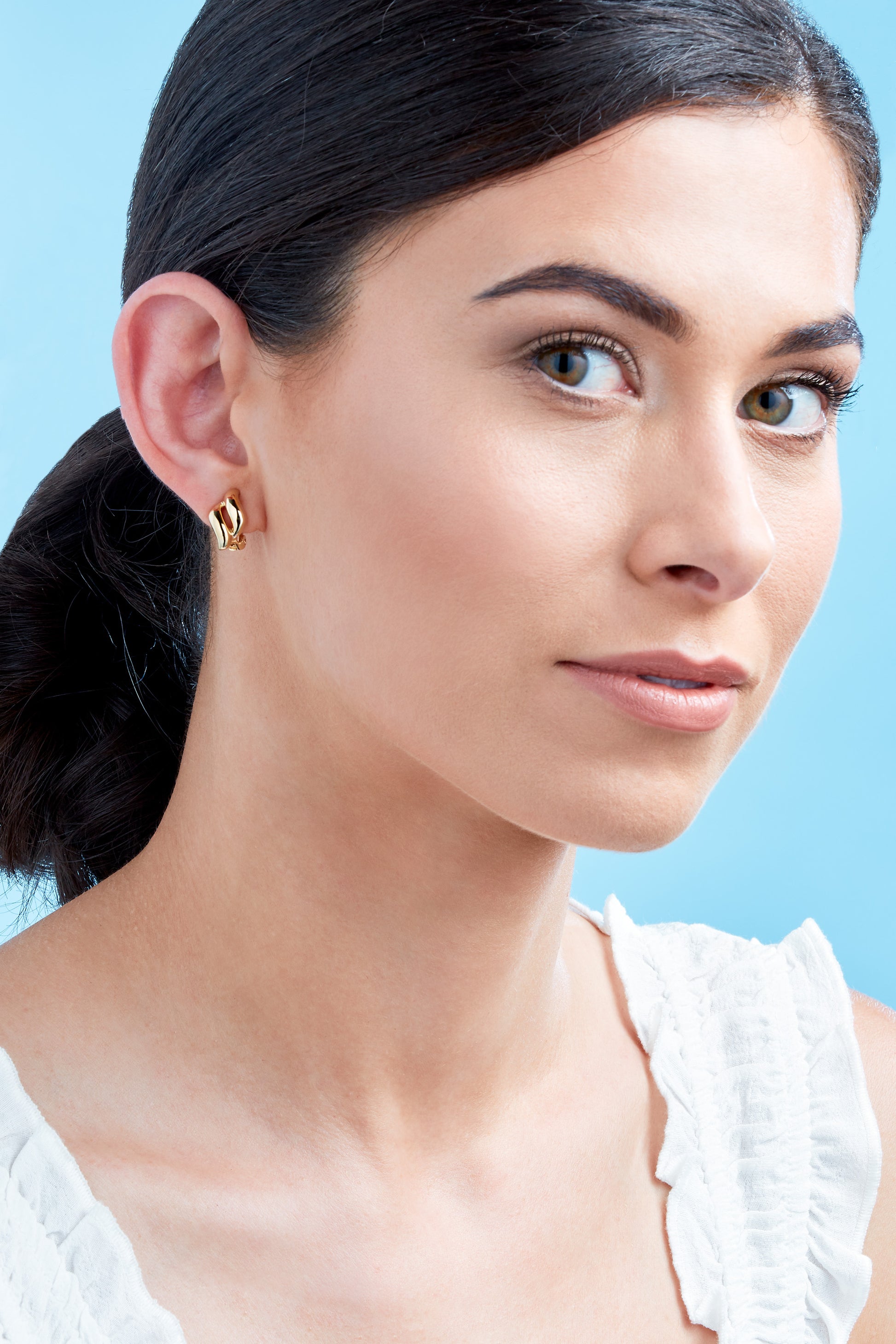 A model wearing Emma Holland Gold Diamond Clip on Earrings