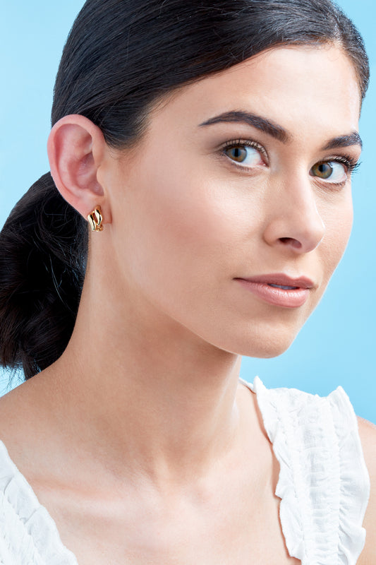 A model wearing Emma Holland Gold Diamond Clip on Earrings