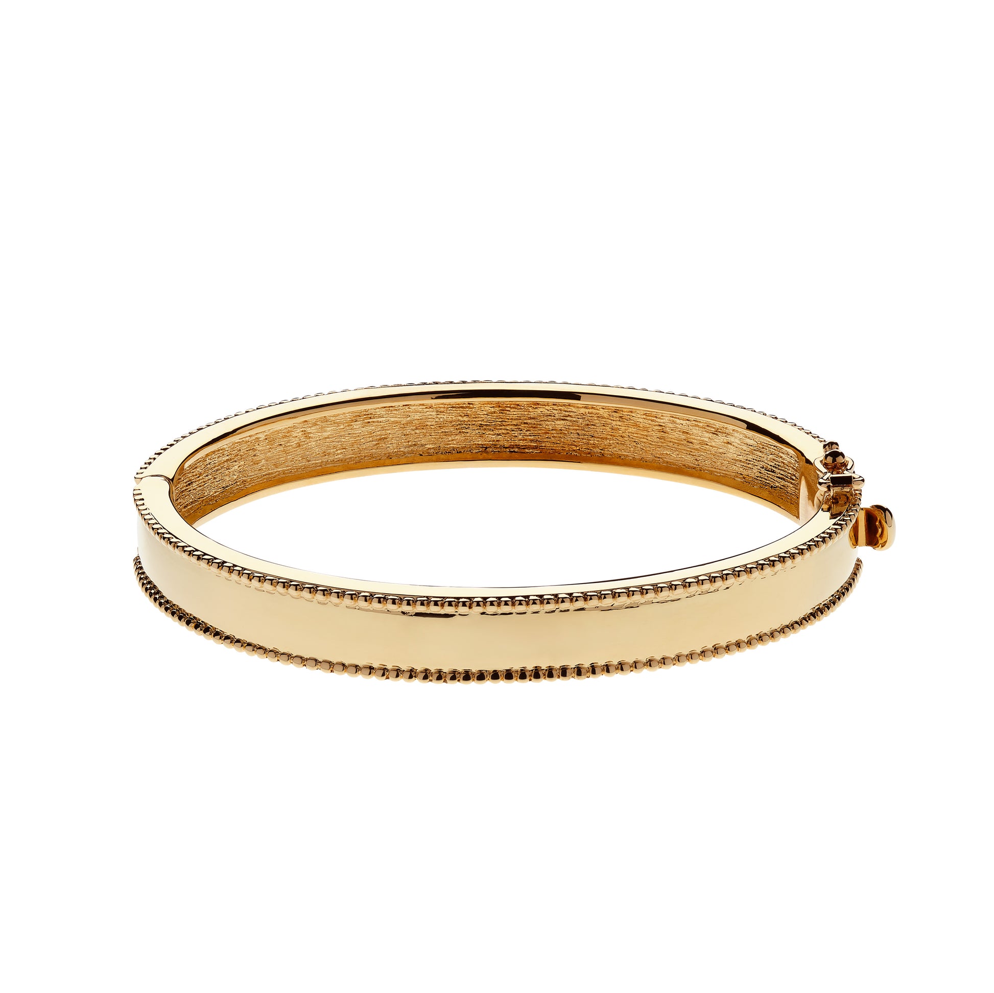 Gold bangle on a white background