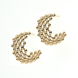 Gold hoop earrings with a textured design on a white background