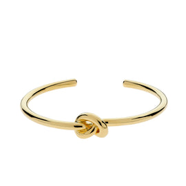 Gold knot bangle on a white background