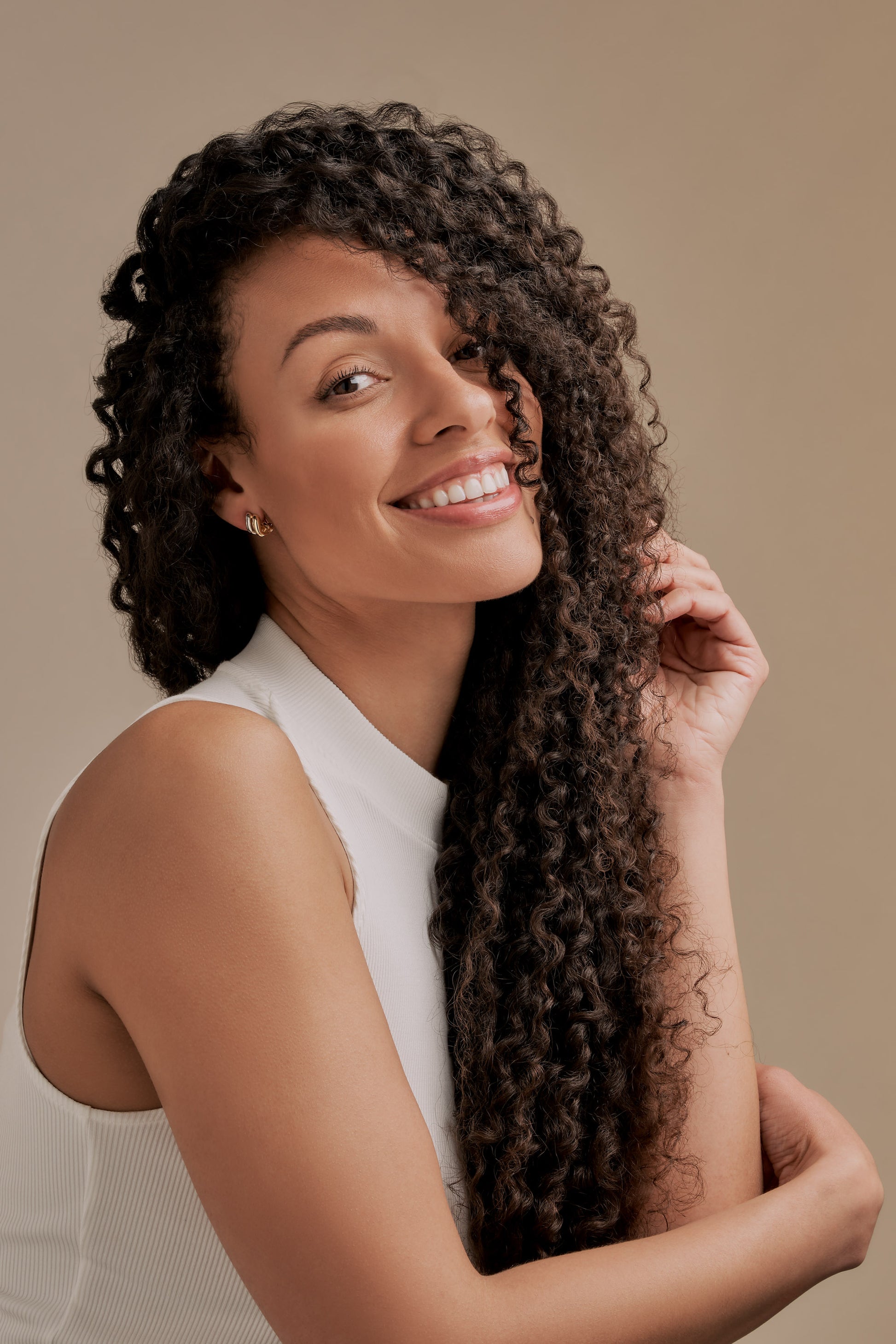 Model with gold and platinum clip on earrings