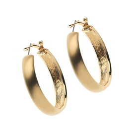 Gold hoop earrings on a white background