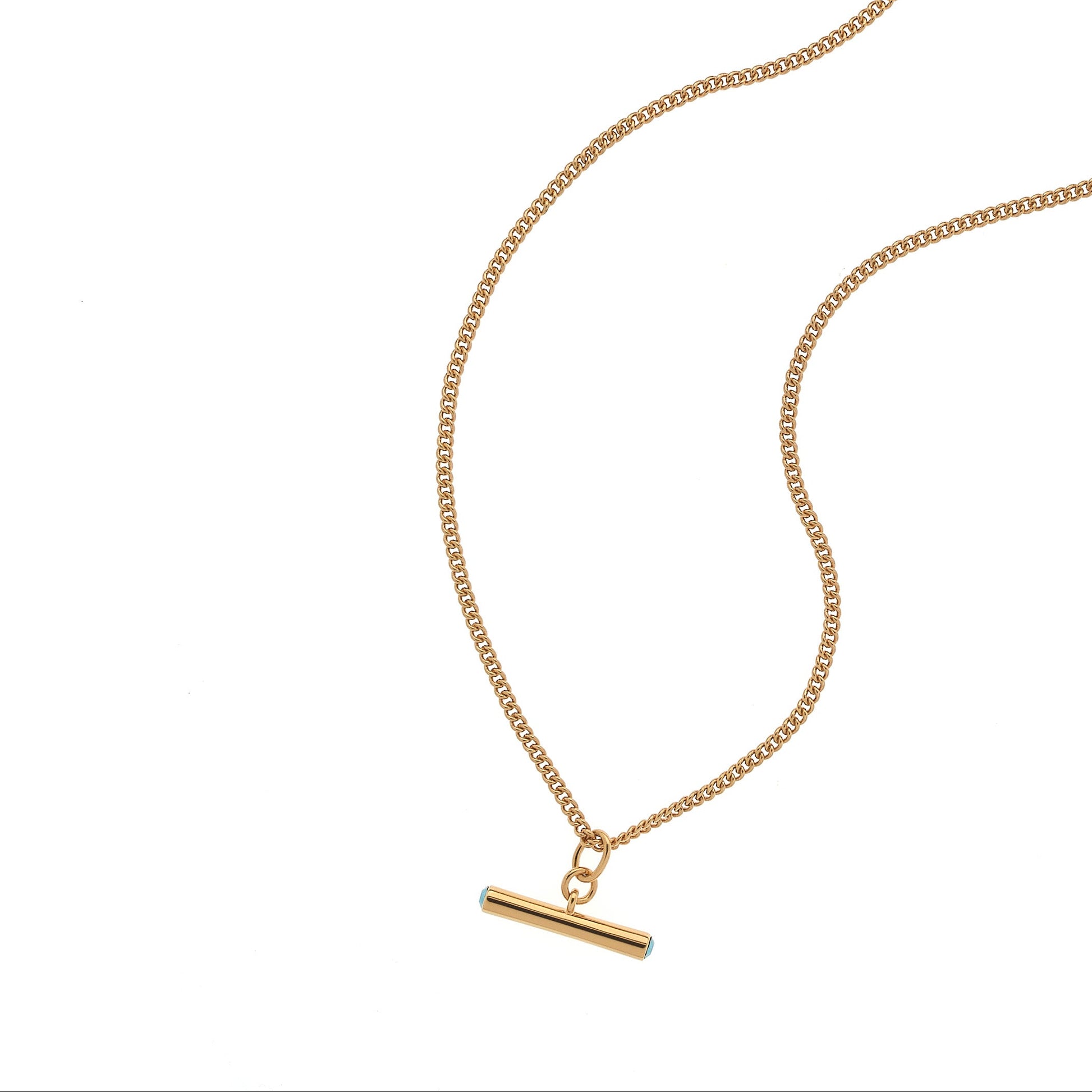 Gold necklace with a bar pendant on a white background