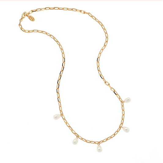 Gold chain necklace with pearls on a white background