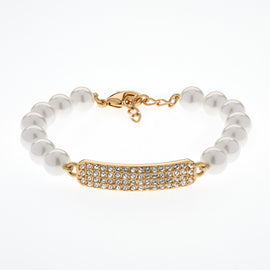 Pearl bracelet with a gold clasp and decorative bar on a white background