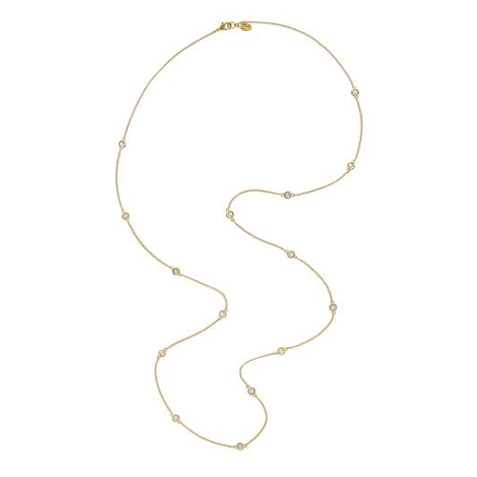 Gold necklace with small beads on a white background