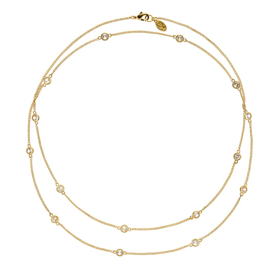 Gold necklace with small cz stone crystals on a white background