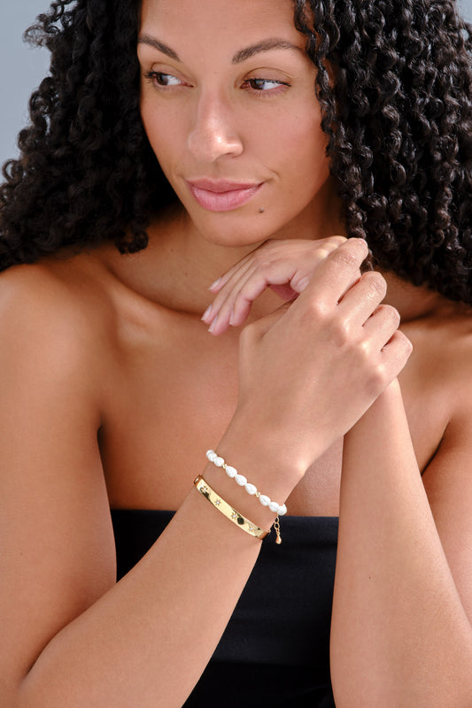 Gold and crystal star bangle and pearl bracelet