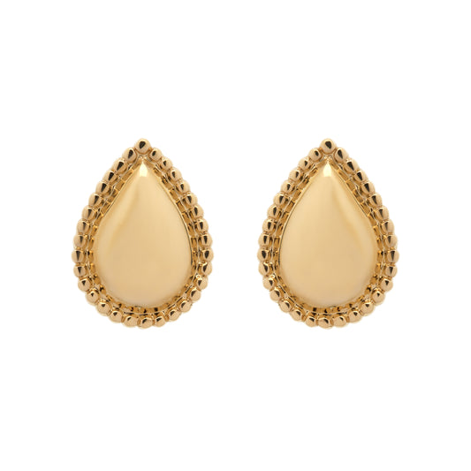 Gold teardrop earrings on a white background